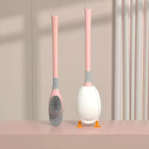 Pink dual-head toilet cleaning brush with flexible bristles and ventilated duck base