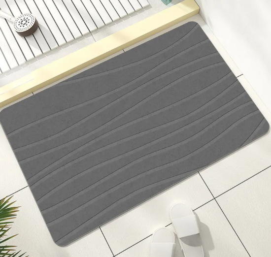 Grey striped diatomite bath mat on a bathroom floor – quick-dry non-slip bathroom mat